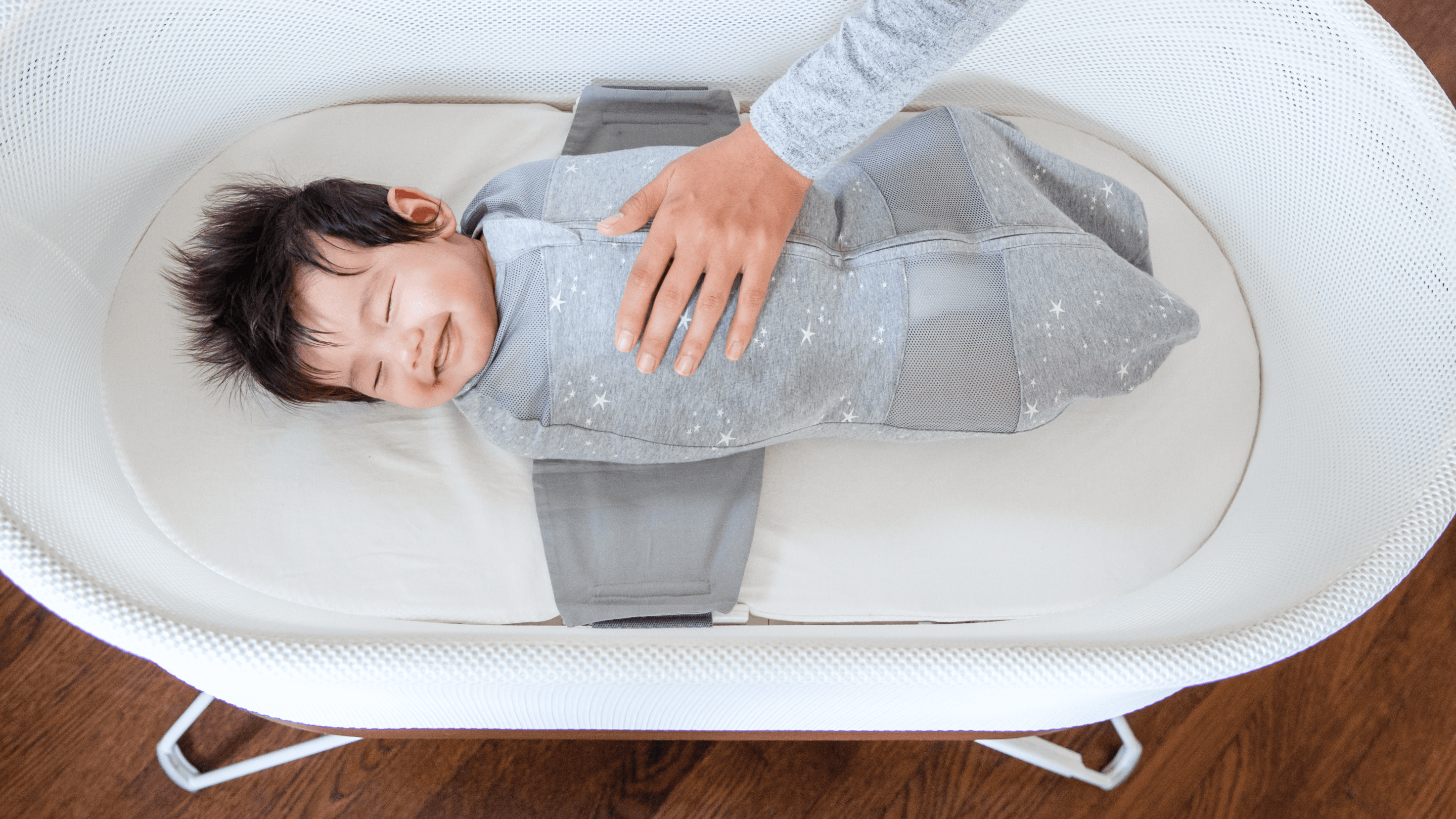 Baby smiling in SNOO