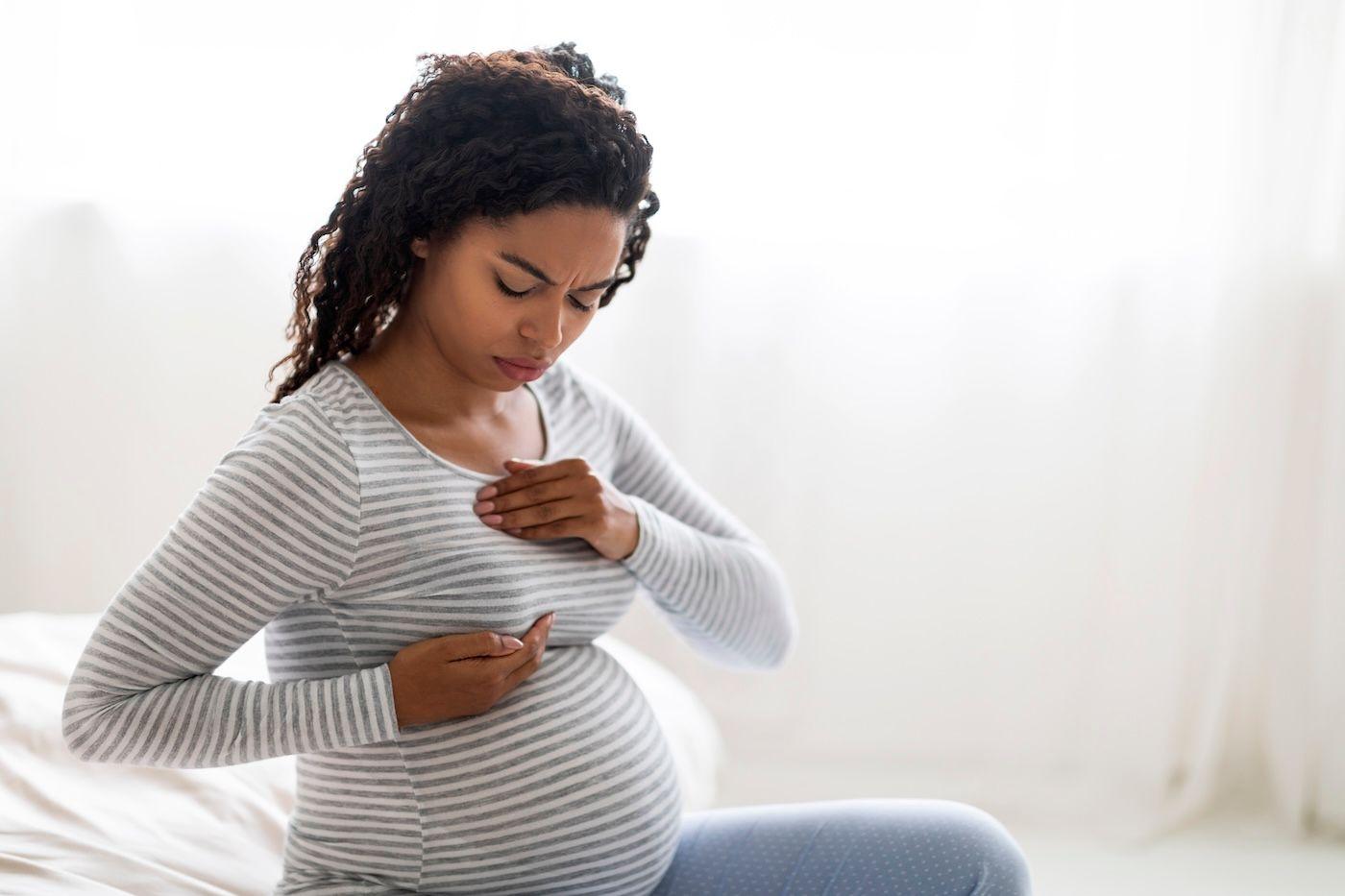 A pregnant woman deals with breast discomfort