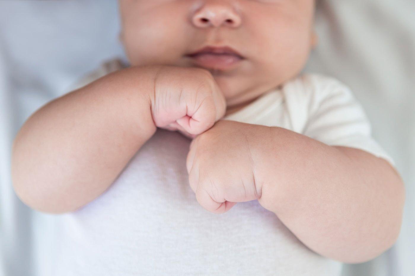 Baby with clenched fists