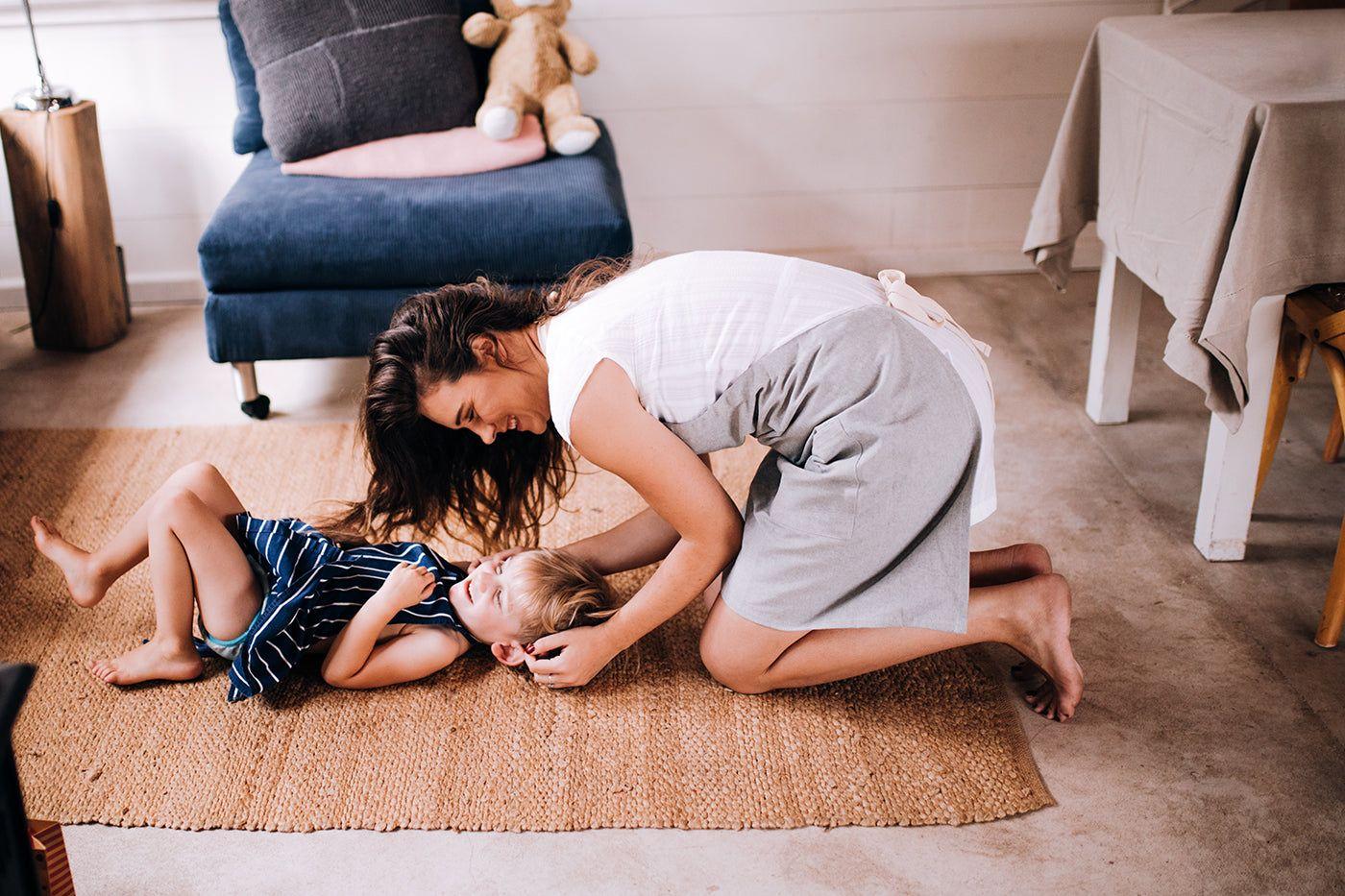 mom-playing-on-the-floor-with-son